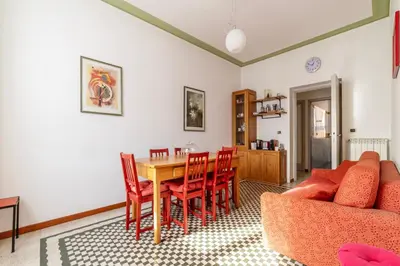 a living room with a table and chairs at GuestHost - Bright and roomy apartment in Flaminio district in Rome