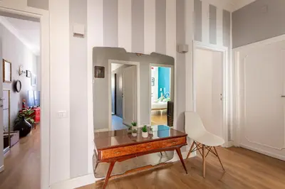 a room with a table and a mirror at iFlat Charming Vintage Apartment in Esquilino in Rome