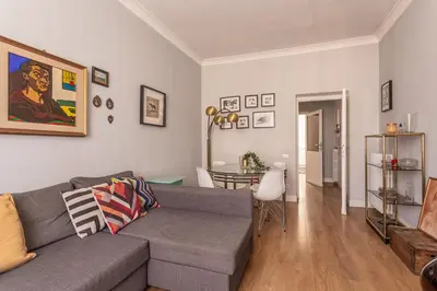 a living room with a couch and a table at iFlat Charming Vintage Apartment in Esquilino in Rome