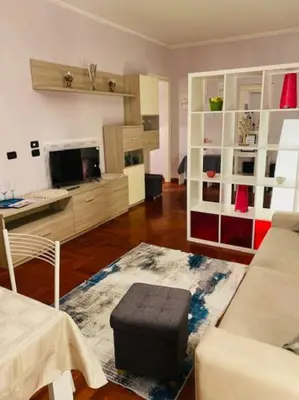 a living room with a couch and a table at Cin Cin ROMA Centro in Rome