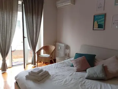 a bedroom with a bed with towels on it at Cin Cin ROMA Centro in Rome