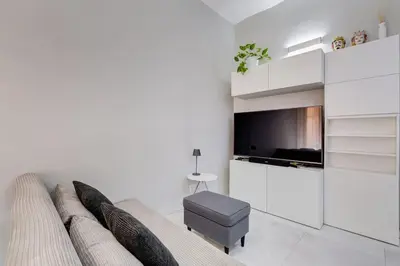 a living room with a couch and a tv at Vatican Escape in Rome