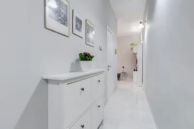 a white bathroom with a sink and a mirror at Vatican Escape in Rome