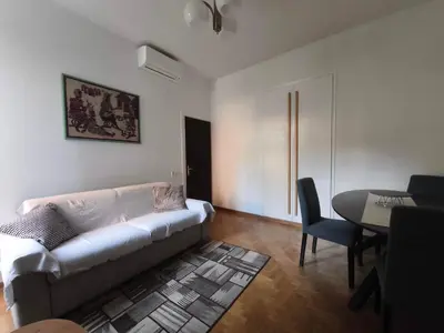 a living room with a couch and a table at Guest House Garofano in Rome