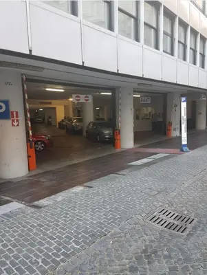 an empty parking garage with cars parked in it at Guest House Garofano in Rome