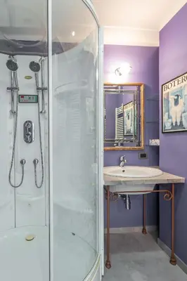 a bathroom with a shower and a sink at Spacious 4 BDR with Parking in Rome