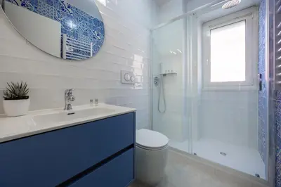 a bathroom with a toilet and a sink and a shower at Vaticano84 Gemelli in Rome
