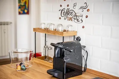 a coffee maker sitting on a counter in a kitchen at Appartamento tra Piramide e Garbatella - Urbe Romana in Rome
