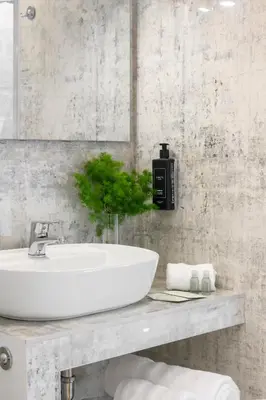 a bathroom with a white sink and a mirror at Tolu Relais in Rome