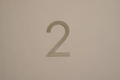 a number on a wall in a room at Tolu Relais in Rome
