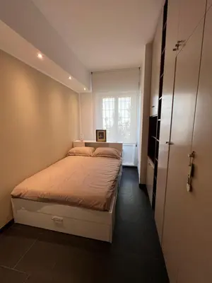 a small bedroom with a bed and a window at StazioneSanPietro53 in Rome