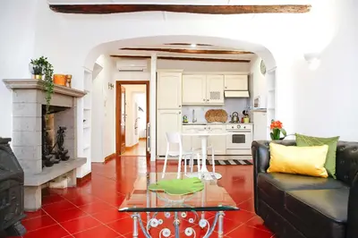 a living room with a couch and a table at Monti Suite with charming Terrace in Rome