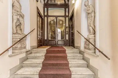 a staircase leading to the front door of a house at Roman Holiday Repubblica in Rome