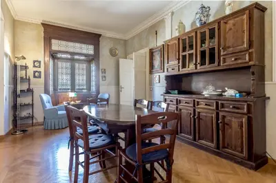 a kitchen with a table and chairs in a room at Roman Holiday Repubblica in Rome