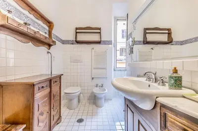 a bathroom with a sink and a toilet at Roman Holiday Repubblica in Rome