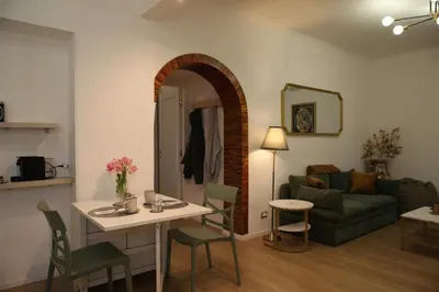 a living room with a couch and a table at MGFCandia111 - Appartamento al Vaticano in Rome
