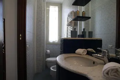 a bathroom with a sink and a toilet at MGFCandia111 - Appartamento al Vaticano in Rome