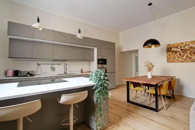 a kitchen and dining room with a table and chairs at Boncompagni79 design & comfort in the City Center Villa Borghese in Rome