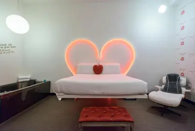 a bedroom with a bed with a heart shaped headboard at Magenta Campo dei Fiori in Rome