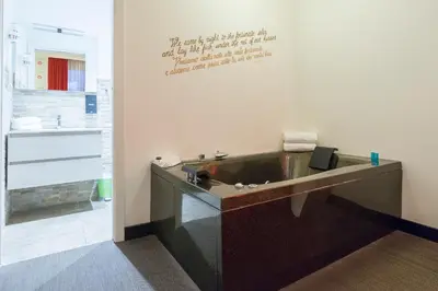 a bathroom with a sink and a bath tub at Magenta Campo dei Fiori in Rome