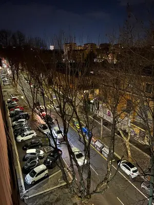 a parking lot full of cars parked in a parking lot at Francis house in Rome