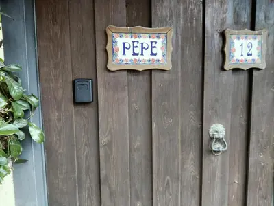 a wooden door with a pepe sign on it at Gemelli-St Peter Sweet House in Rome