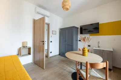 a living room with a table and a tv at cRoma - guest house in Rome