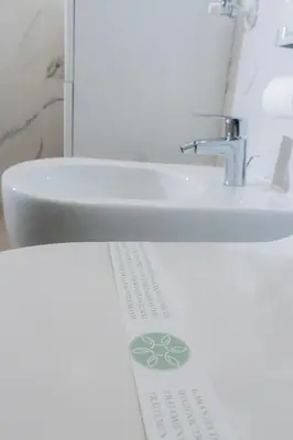a bathroom with a white sink and a white sink at Green Garden in Rome