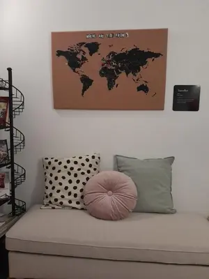 a room with a couch with a map on the wall at Acche Apartments in Rome