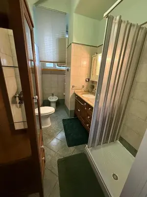 a bathroom with a shower and a toilet and a sink at Charming Hideaway in P R A T I near Piazza Clodio in Rome