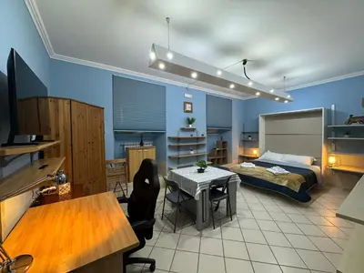 a bedroom with a bed and a table with chairs at Charming Hideaway in P R A T I near Piazza Clodio in Rome