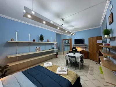 a bedroom with a bed and a table in a room at Charming Hideaway in P R A T I near Piazza Clodio in Rome