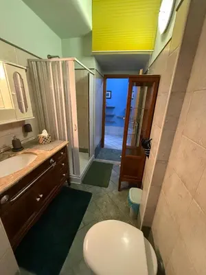 a bathroom with a toilet and a sink and a shower at Charming Hideaway in P R A T I near Piazza Clodio in Rome