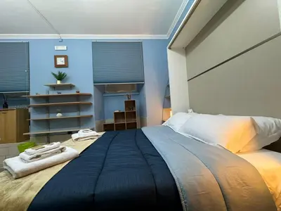 a bedroom with a large bed with towels on it at Charming Hideaway in P R A T I near Piazza Clodio in Rome