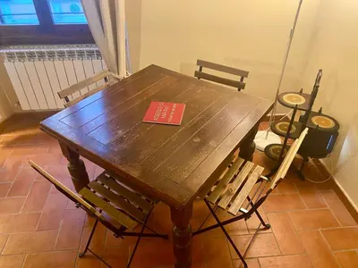 a book sitting on top of a wooden table at Casa dolce Casa Trastevere in Rome