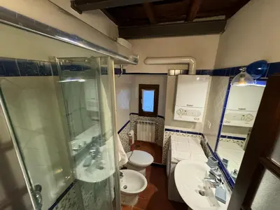 a bathroom with two sinks and a shower and a toilet at Casa dolce Casa Trastevere in Rome