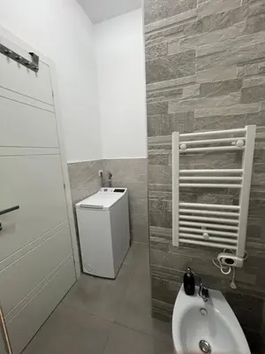 a bathroom with a tub and a toilet and a sink at Monteverde COME a casa -HOME- in Rome