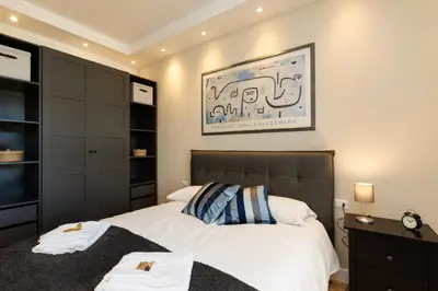 a bedroom with a bed with two towels on it at Vaticano Appartamento Suite Roma Centro Aura D1 in Rome