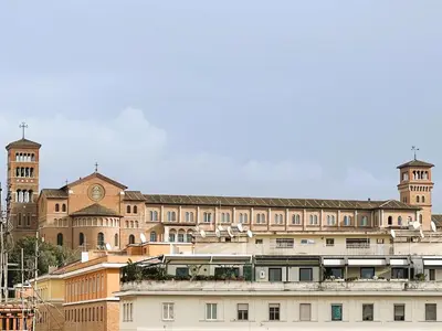 a large building with a clock tower on top of it at Home Roma Testaccio in Rome