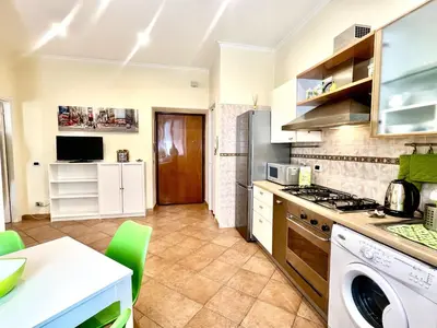 a kitchen with a sink and a stove top oven at Home Roma Testaccio in Rome