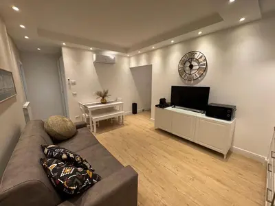 a living room with a couch and a flat screen tv at Vaticano Appartamento Suite Roma Centro Aura D4 in Rome