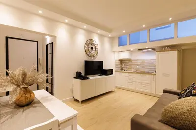 a living room with a couch and a tv at Vaticano Appartamento Suite Roma Centro Aura D4 in Rome