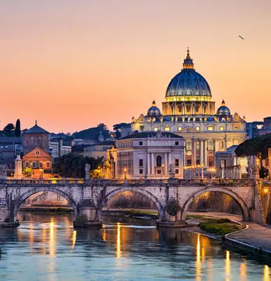 a bridge over a river in front of a building at OASI - Vaticano 3Clima Netflix Wi-Fi Parking Garden in Rome