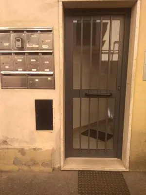 a glass door with a metal gate on a building at YourStay@Rome Vatican in Rome