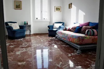 a living room with a couch and two chairs at Heartwarming Apartment in ROMA - 5 Minutes from Colosseum in Rome