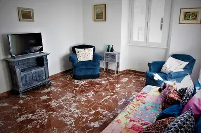 a living room with a floor covered in water at Heartwarming Apartment in ROMA - 5 Minutes from Colosseum in Rome