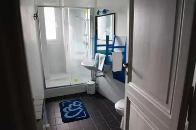 a bathroom with a shower and a toilet and a sink at Heartwarming Apartment in ROMA - 5 Minutes from Colosseum in Rome