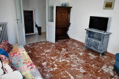 a living room with a floor covered in water at Heartwarming Apartment in ROMA - 5 Minutes from Colosseum in Rome