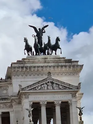 a large building with columns on the side of it at You'RhomeSuite in Rome