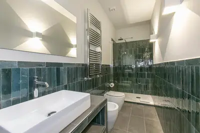 a bathroom with a sink and a toilet at Home Baccina 28 in Rome